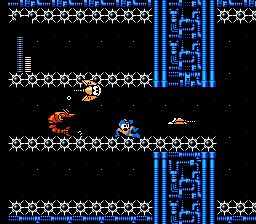 Mega Man slides among enemies.