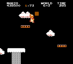 Mario grabs a Fire Flower powerup in level 6-3.